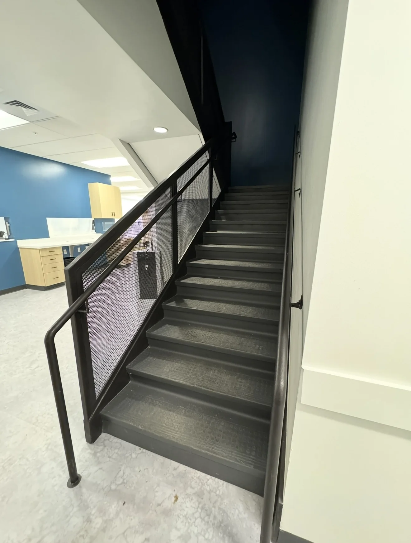 Interior steel stair and perforated rail by Jaime's Welding Contractors